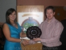 Gregory O'Kane presents Breige Mullaghan the County Junior Camogie Shield